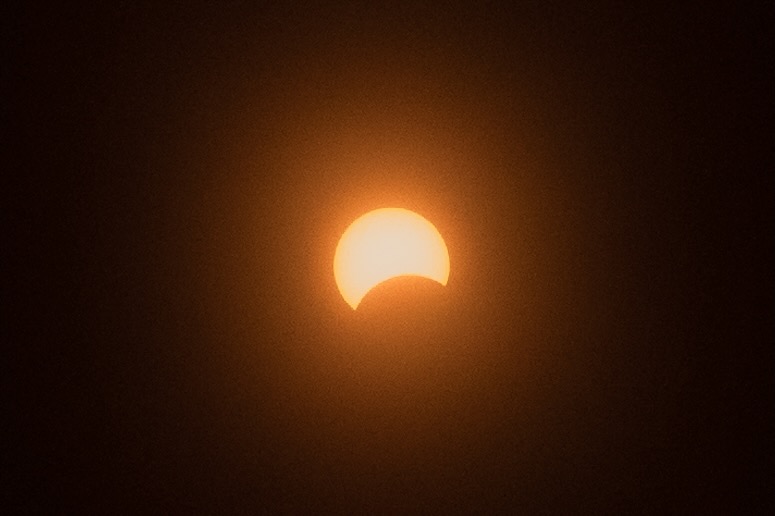 A picture of a partial solar eclipse.