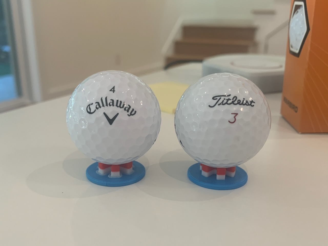 Two golf balls on flat golf tees
