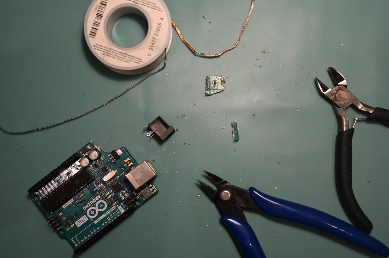 A barrel jack cut off of an Arduino Uno board