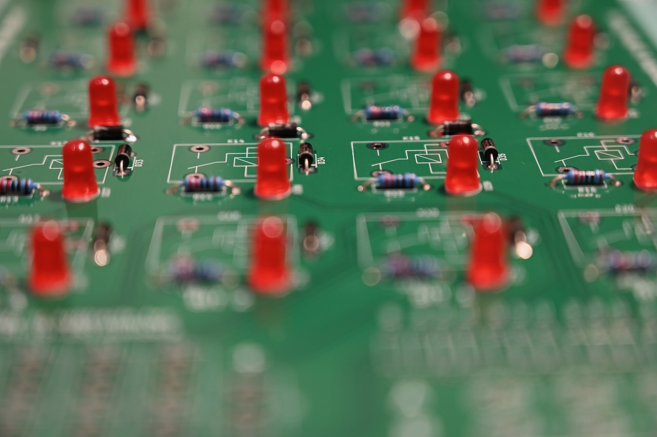 Diodes, resistors, and LEDs on a circuit board