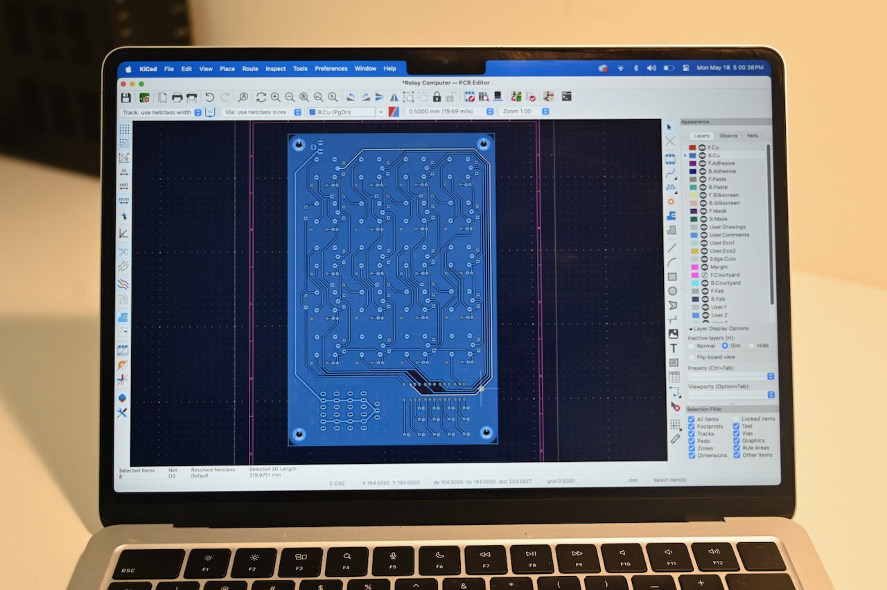 A printed circuit board in KiCad on a laptop