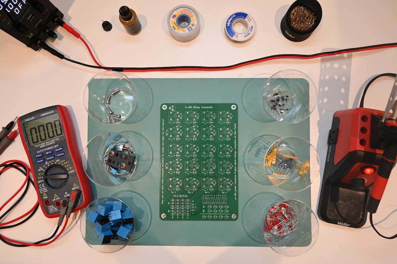A soldering iron and other tools surrounding a circuit board